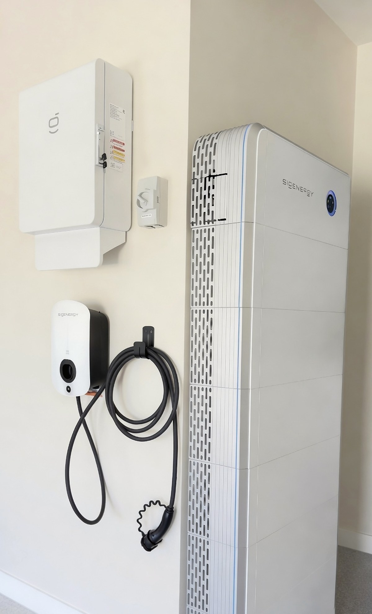 EV charger and floor-standing home battery installed together in a garage at Camp Hill